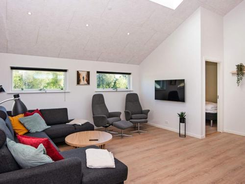 a living room with a couch and a table at 12 person holiday home in Ansager-By Traum in Ansager