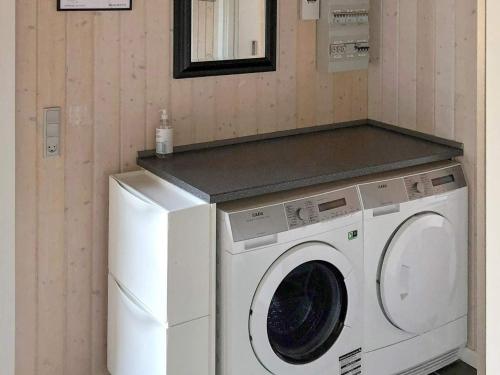 a washing machine and a washer in a room at 8 person holiday home in Ansager in Ansager