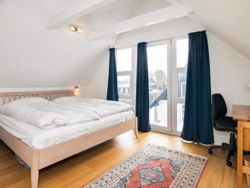 Postel nebo postele na pokoji v ubytování Holiday home Otterup XXII