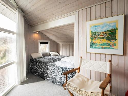 a bedroom with a bed in a room with a window at 6 person holiday home in Hjørring-By Traum in Vester Vidstrup