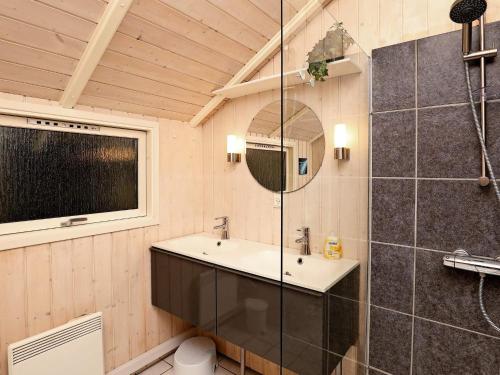 a bathroom with a sink and a mirror at Secluded Retreat in Koldkaer - By Traum Ferienwohnungen in Hals