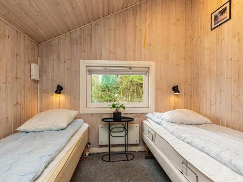 En eller flere senge i et værelse på Four-Bedroom Holiday home in Humble 1