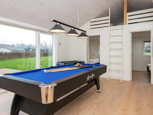 a pool table in the middle of a room at 8 person holiday home in Sydals in Mommark