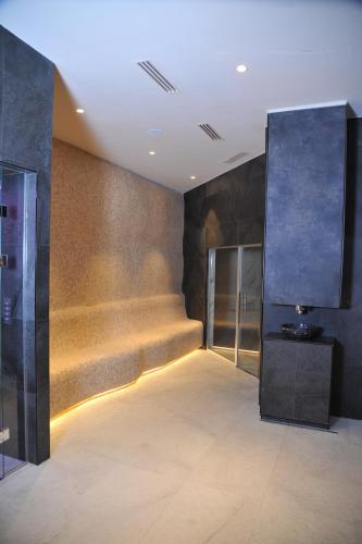 a room with a hallway with stairs and a large screen at Family Apart Woodside in Kopaonik