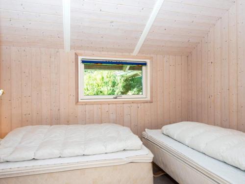 a room with two beds and a window at 6 person holiday home in Ansager-By Traum in Ansager