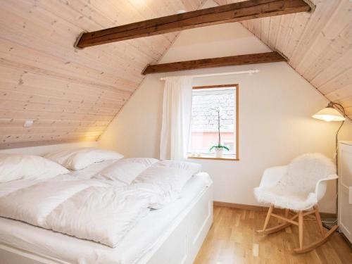 En eller flere senge i et værelse på Holiday home Læsø XLI