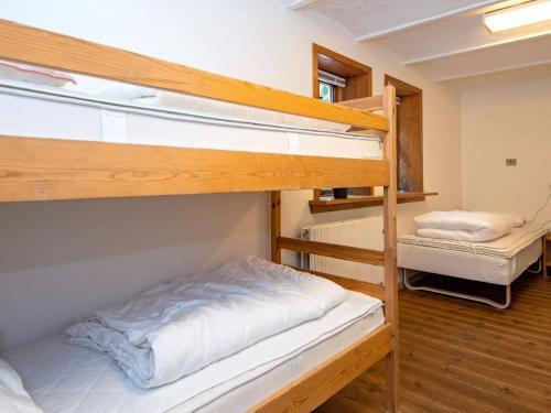 a bedroom with two bunk beds in a room at 16 person holiday home in Skjern-By Traum in Skjern