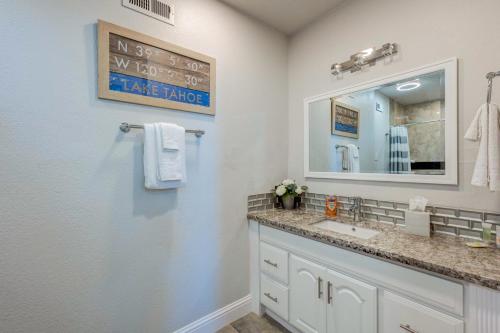a bathroom with a sink and a mirror at Casa Azul in Incline Village