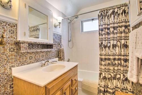 a bathroom with a sink and a shower at Elegant Home with Deck, 5 Blocks to Mayo Clinic in Rochester