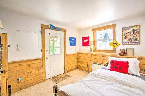 a bedroom with a bed with a red pillow at Cozy North Conway Home Walk to Slopes and Dtwn in North Conway
