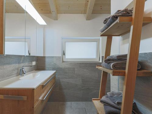 a bathroom with a sink and a loft at Michelle Top 1 in Bramberg am Wildkogel