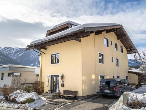 a house with a car parked in front of it at Haus-Verena in Neukirchen am Großvenediger