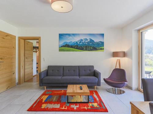 a living room with a couch and a table at Haus Rabl Hansi in Itter