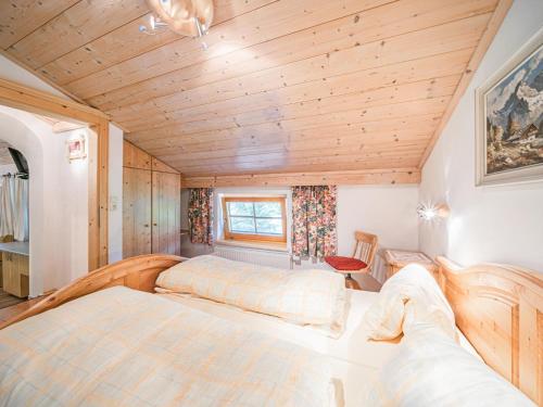 a bedroom with two beds in a room at Weberhof Top 3-4-5 in Brixen im Thale