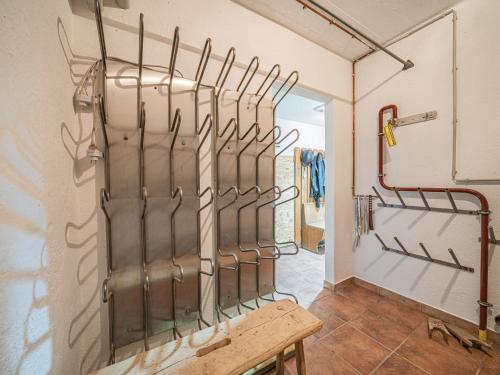 a room with a bunch of utensils on the wall at Weberhof Top 3-4-5 in Brixen im Thale