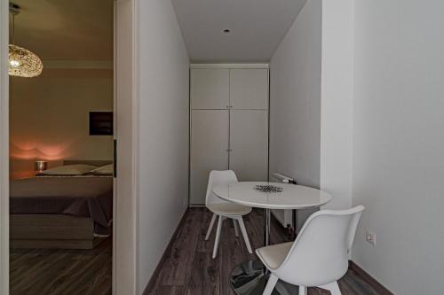 a small room with a table and chairs and a bed at Apartments with parking space Orebic, Peljesac - 646 in Orebić