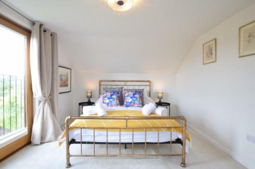 a bedroom with a bed and a window at Skelder, Parham in Parham