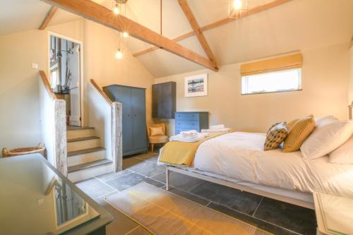 a bedroom with a bed in a room at Halcyon Barn, Wissett in Wissett