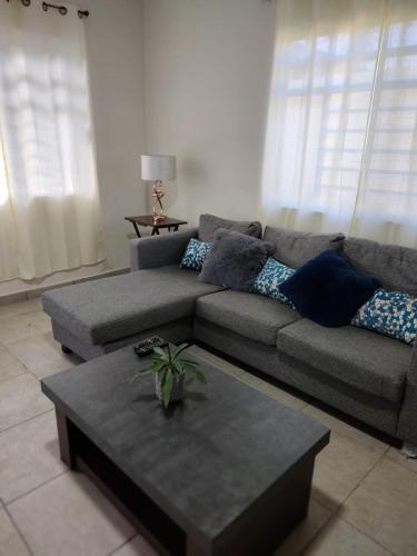 a living room with a couch and a coffee table at Casa equipada Cd Valles in Ciudad Valles