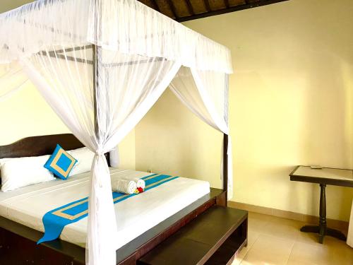 Katil atau katil-katil dalam bilik di Lakromo Amed Homestay