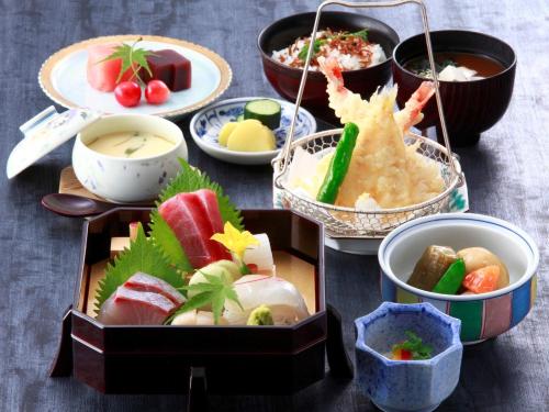 a bunch of different types of food on a table at Hotel East 21 Tokyo in Tokyo
