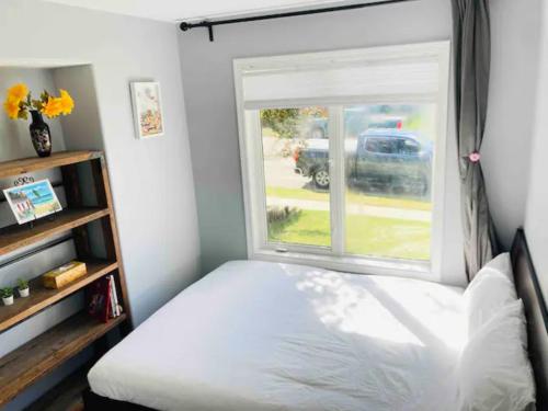 a bedroom with a bed and a window at Sweet 5 bedrooms single house in Hinton in Hinton