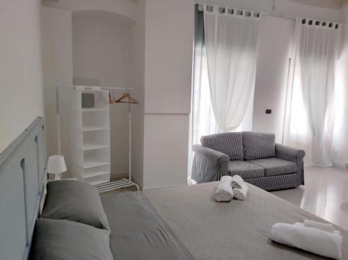 Ένα ή περισσότερα κρεβάτια σε δωμάτιο στο La Piazza