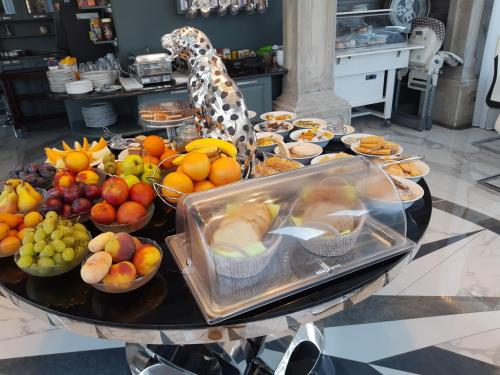 a table with a bunch of fruit on it at Vila Lemic Postojna in Postojna