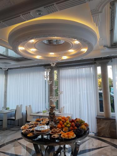 a table with fruit on it in a room at Vila Lemic Postojna in Postojna