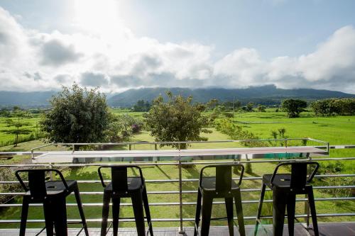 a group of chairs sitting on a balcony with a view at Baan chomphu @Pua in Pua