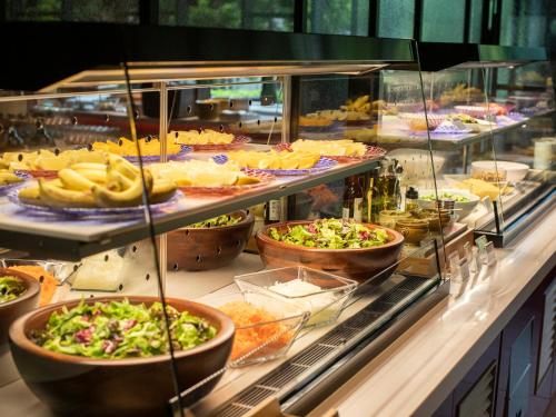 a buffet line with many different types of food at Tokyo Bay Shiomi Prince Hotel in Tokyo