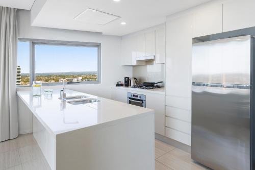 Una cocina o zona de cocina en Meriton Suites Zetland