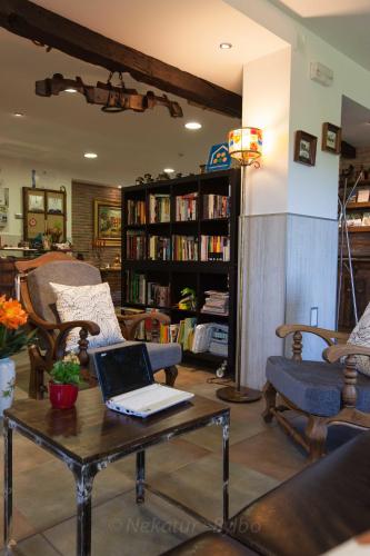 a living room with a table with a laptop on it at Gorosarri in Escoriaza