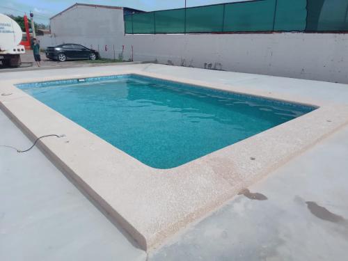 a swimming pool with blue water in a building at Hacienda Gallardos 104-3 in San Carlos