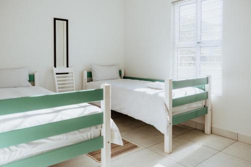 Ένα ή περισσότερα κρεβάτια σε δωμάτιο στο 12 Korhaan