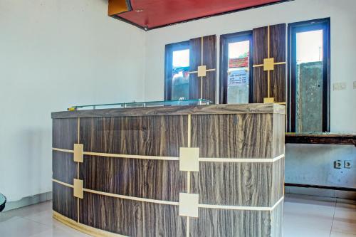 a wooden box with yellow crosses on it in a room at Hotel O Yotowawa NearBukit Cinta in Kupang