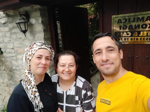a man and a woman posing for a picture at Çamlıca Konak Çarsı in Safranbolu