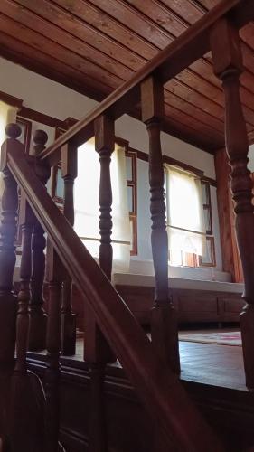 a wooden staircase in a house with windows at Çamlıca Konak Çarsı in Safranbolu