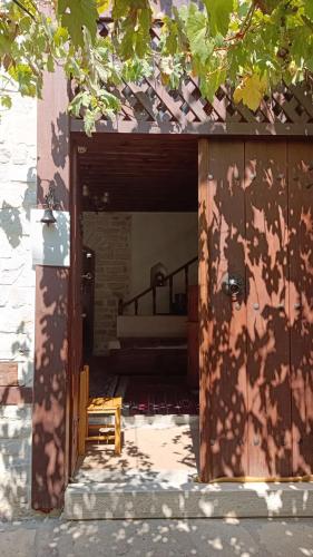 an open door of a building with a bed in it at Çamlıca Konak Çarsı in Safranbolu