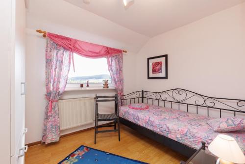 Ένα ή περισσότερα κρεβάτια σε δωμάτιο στο Fewo Röspe