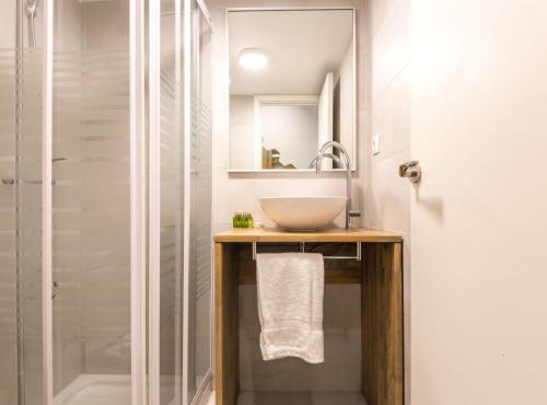 a bathroom with a sink and a shower at Find Calm at this cozy City Sanctuary with terrace in Barcelona