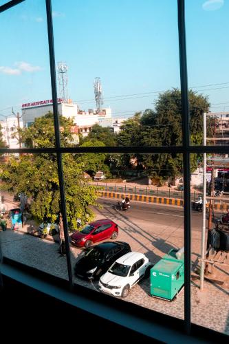 a view of a parking lot from a window at Royal 9 hotel & Banquet in Meerut