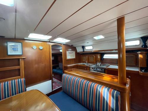 a kitchen in the back of a train car at Beautiful and comfortable sailboat with secure parking available in Barcelona