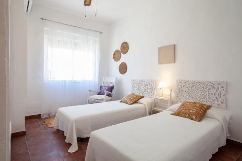 Postel nebo postele na pokoji v ubytování SWEET HOME LOS BELONES