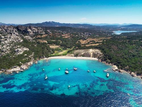 an aerial view of a beach with boats in the water at La Vecchia Fonte Boutique Hotel in Palau