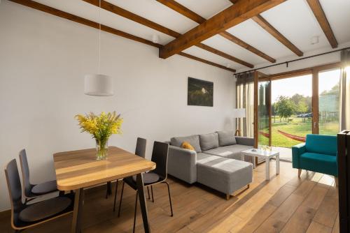 a living room with a couch and a table at Moje Miejsce Jura in Lgota Murowana