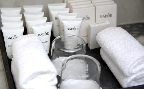 a bottle of milk and other products on a table at The Lamp Hotel & Spa in Norrköping