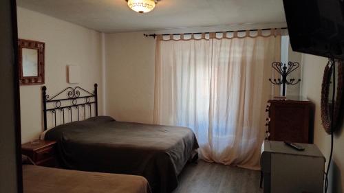 Katil atau katil-katil dalam bilik di Hostal Colon Antequera