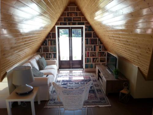 a living room with a couch and a table at Villa Ana in Nazaré