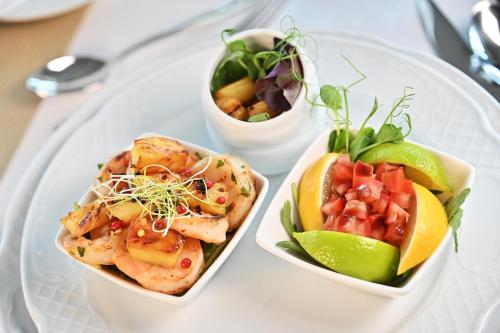 two dishes of food on a white plate at Hotel Eger & Park in Eger